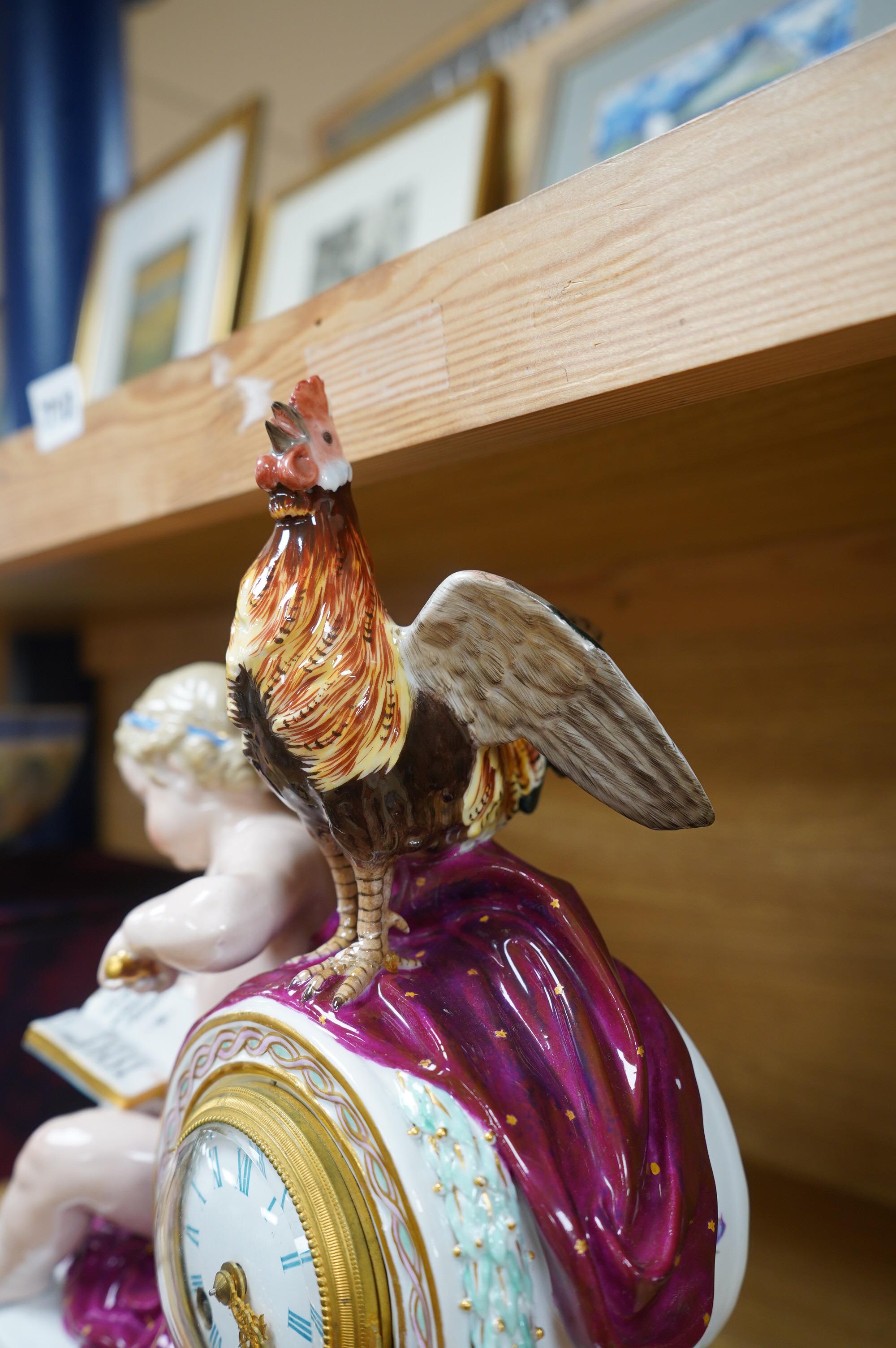 A Meissen figural mantel clock with cockerel surmount, French movement striking on a bell, 29cm high. Condition - poor